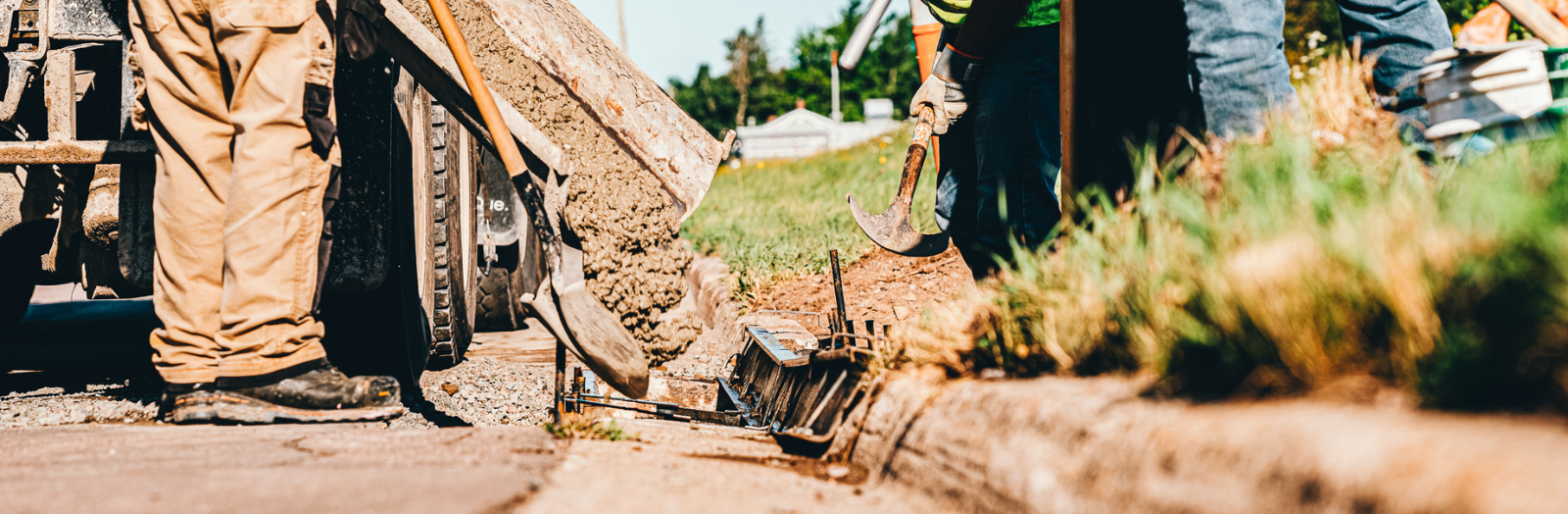 Road construction workers and heavy equipment