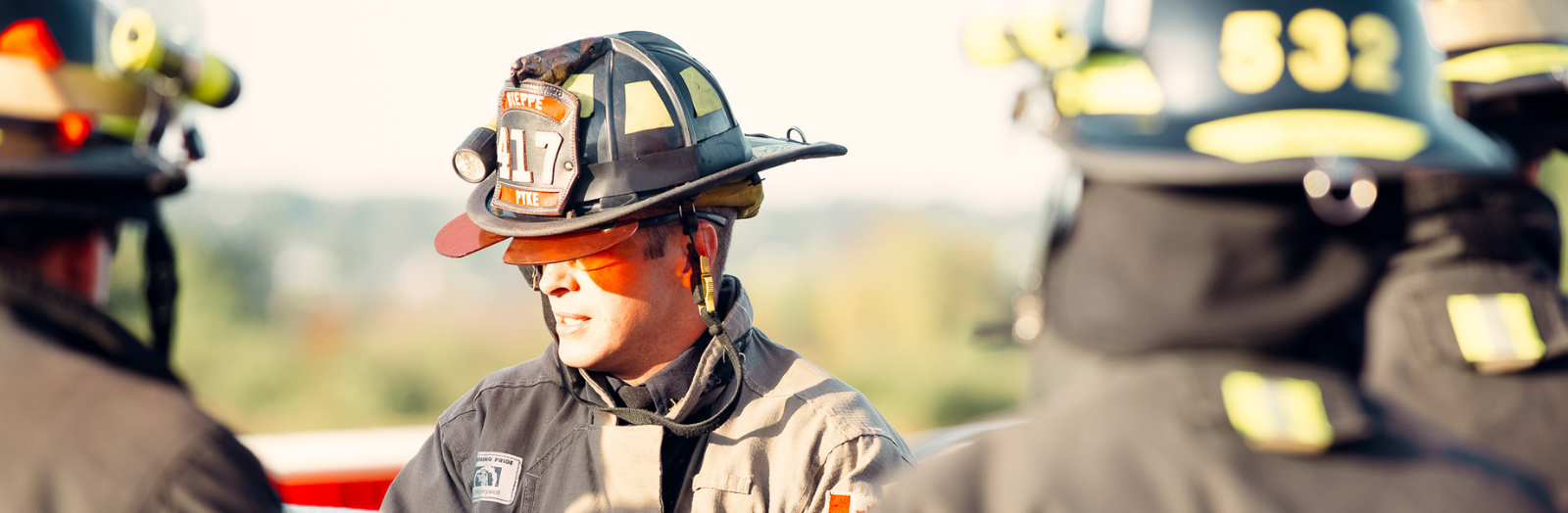 Firefighter speaking with other firefighters